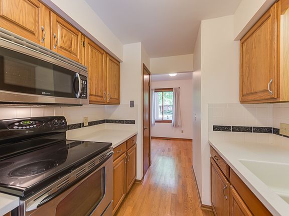 Additional view of the updated kitchen with good counter top space for your food preparation and a view of the casual eat in area.