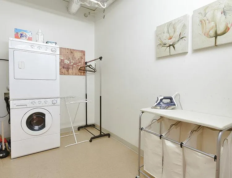 In-unit storage/laundry room with washer and dryer
