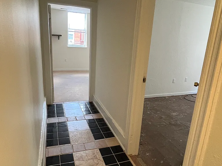 Hallway looking toward bedrooms - carpet to be installed in both bedrooms