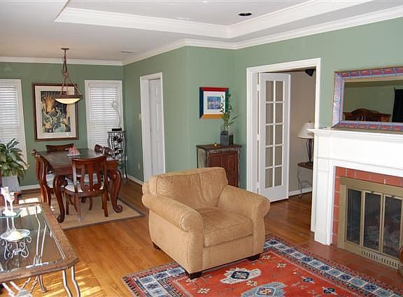 VIEW OF LIVING ROOM AND DINING ROOM