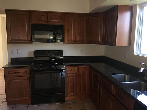 Kitchen with granite counter tops and new appliances