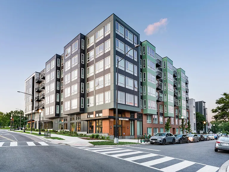 Street-level view of our community along the H Street Corridor, featuring bold architecture, street-facing retail, and an active setting.