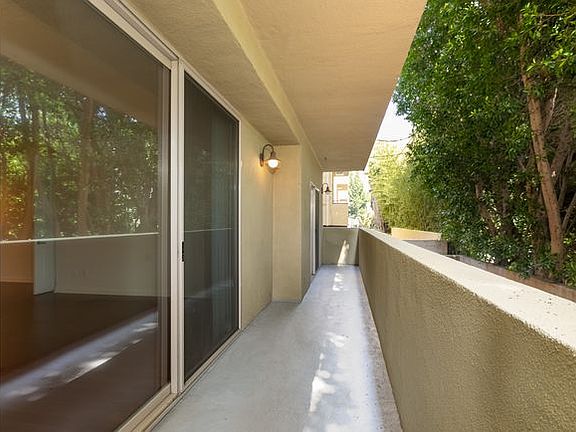 view from sliding glass doors; living room & both bedrooms