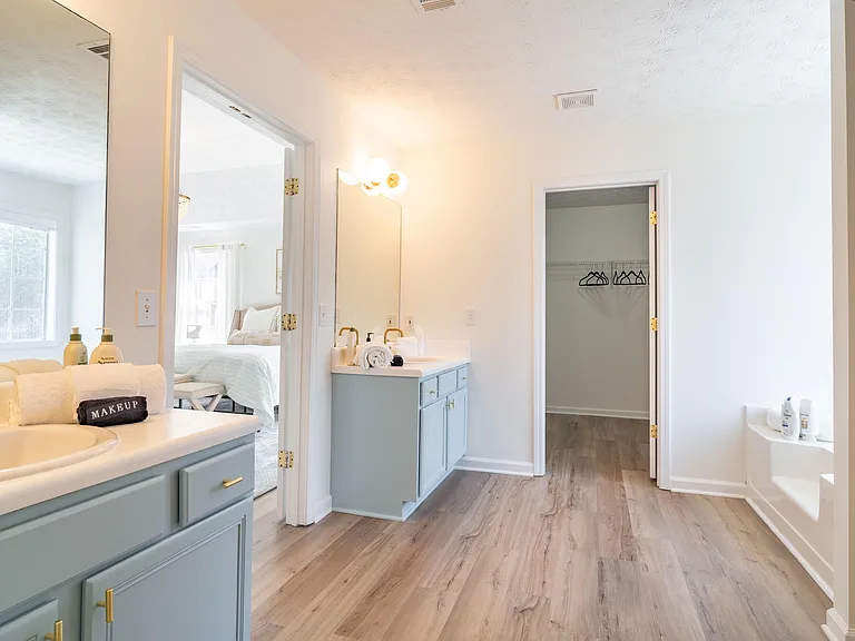 Huge and gorgeous private bathroom with His and Hers vanities.