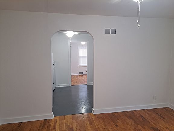 Living room entrance to kitchen and eating area.