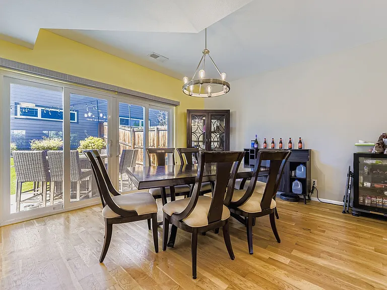 Dining room with double sliding doors to backyard