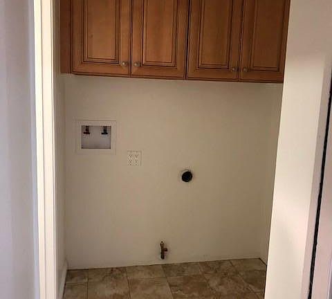 Laundry Room located near kitchen, ready to hook up