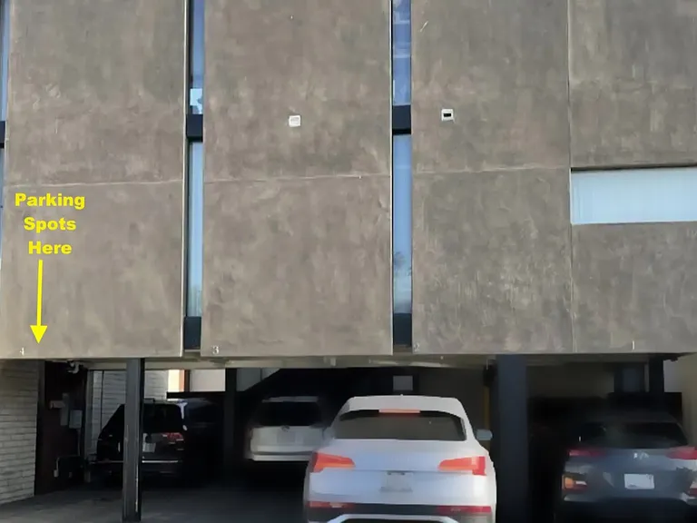 Tandem parking for two cars below home.