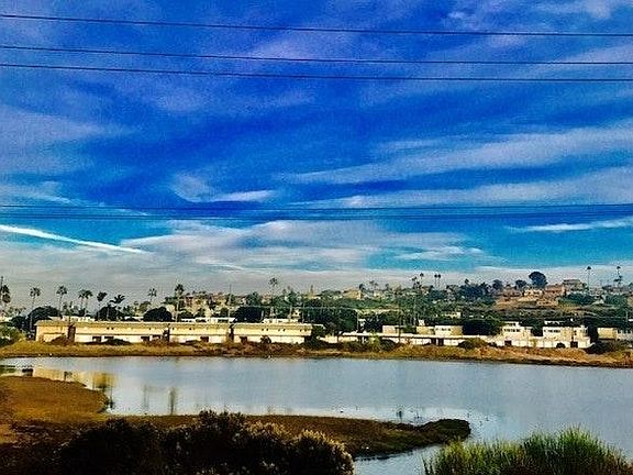 View of Lagoon from nearly every window/door! Spacious & ope