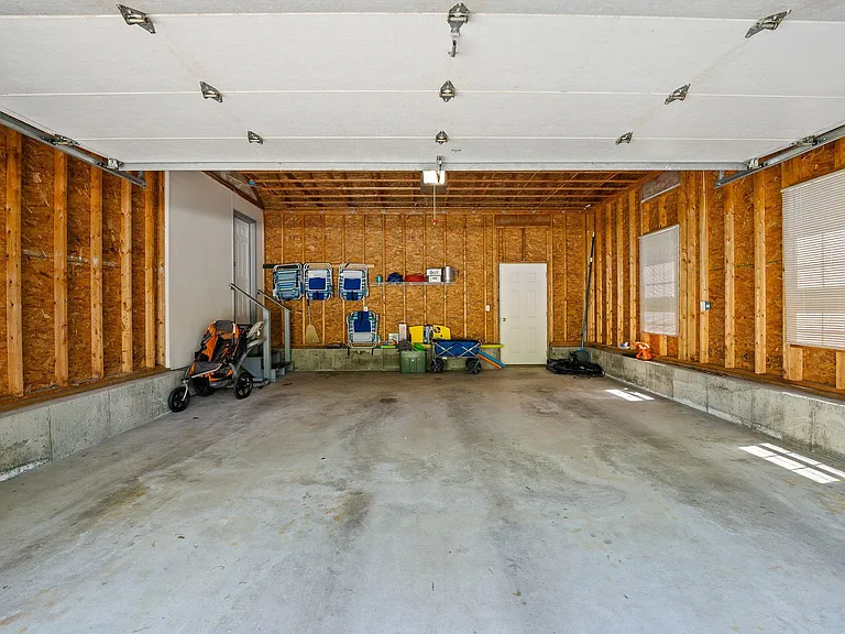 Garage can fit 2 small cars or 1 large car.