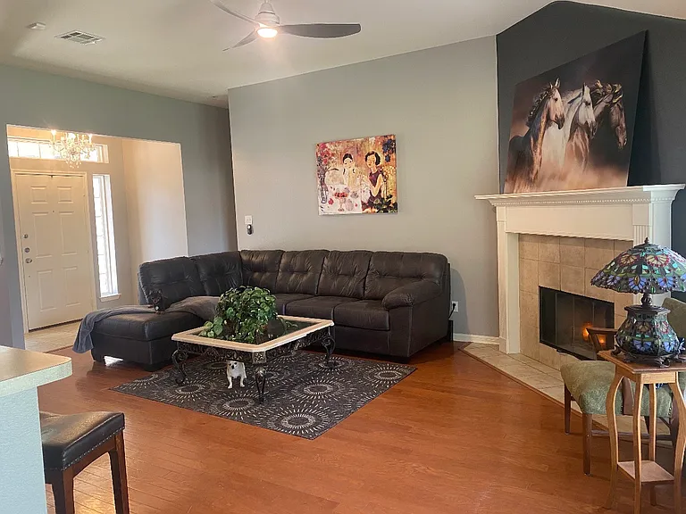 SPACIOUS LIVING AREA, WITH TALL CEILINGS, & A FIREPLACE