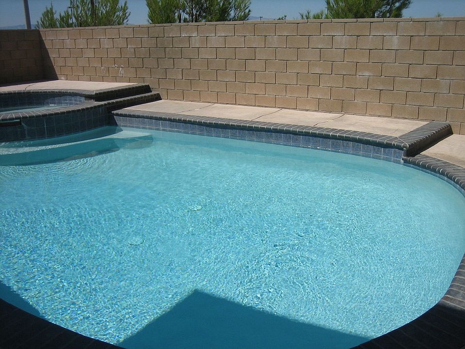 new salt water pool with jacuzzi