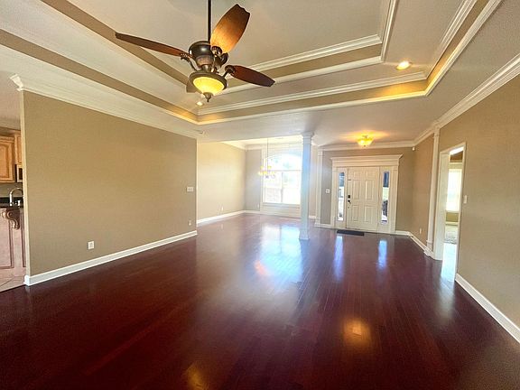 Living Room, looking in direction of Dining Room (L) and Front Door (R)
