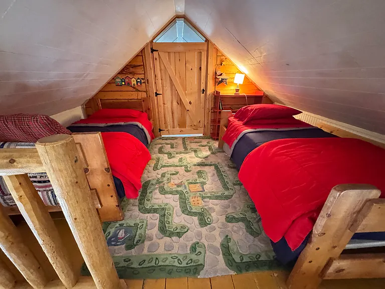 Loft with door closed to back upper level 3rd bedroom