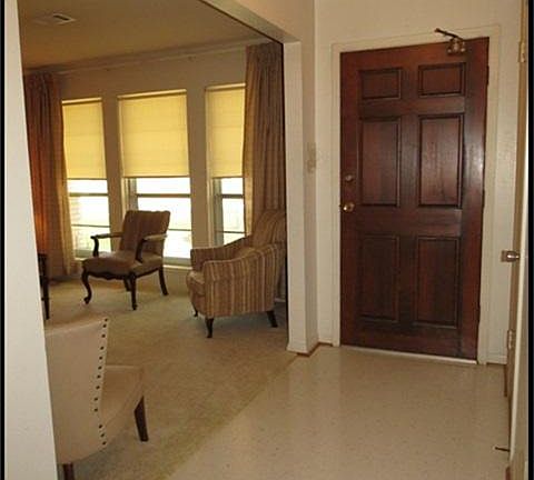 Entry with solid wood front door.