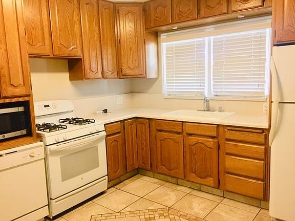 Kitchen with lots of storage including pantry area. Dishwasher, microwave, refrigerator and stove are all included.