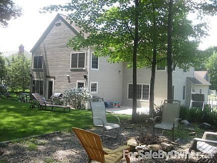 Stone fire pit area
						:
						wooded lot with stone patio, deck and fire pit area.