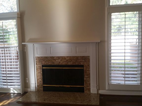 Gas fireplace. Sliding glass door to the left.
