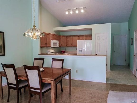 View from end of great room to dining area and kitchen.