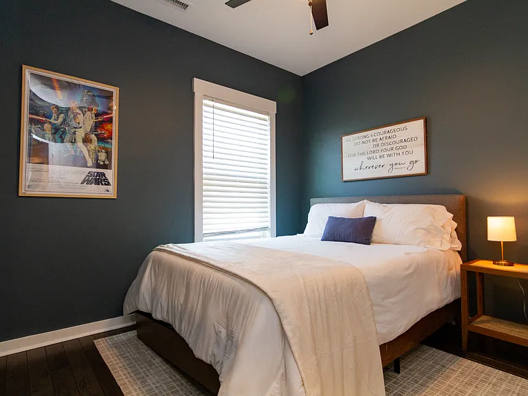Queen size bed that overlooks the green space and a couple local restaurants.