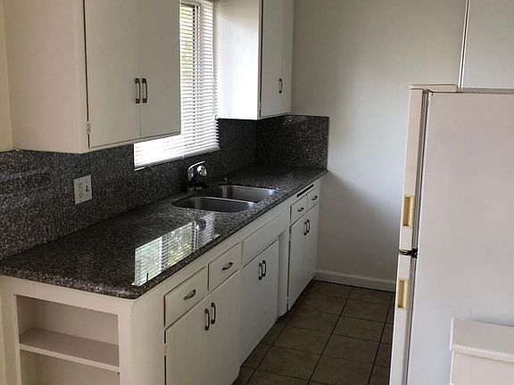Granite Countertops. Stove and Refrigerator Included.