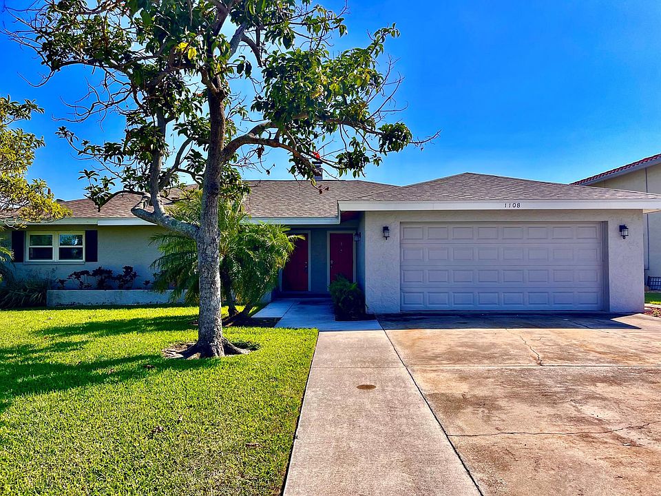 View of front entry, unit 2 is on left. Tenant have 1 space in 2 car garage.