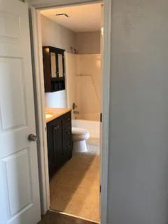 Master bathroom with large marble topped vanity and extra ca