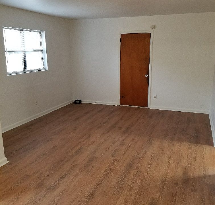 Living Room has a coat closet and a glass storm door