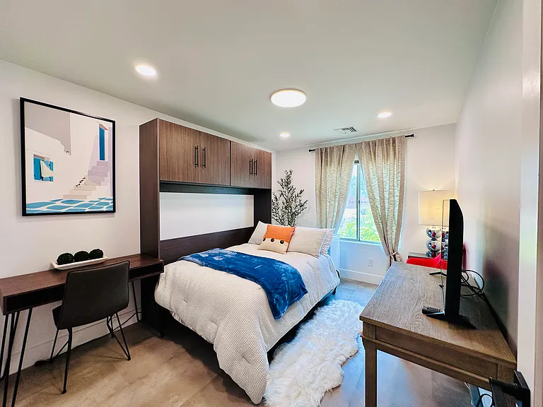 Guest Bedroom 2: 
Versatile Full-size Murphy bed, perfect for maximizing living space during the day.