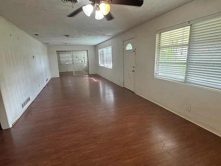 large living room/dining room when you walk inside of the house