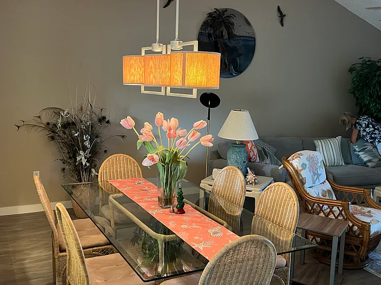 Dining room with vaulted ceiling and open floor plan.