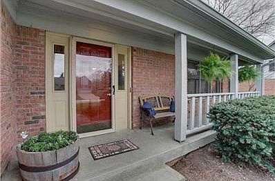 Exterior Front. Front Porch welcomes guests with room for seating.