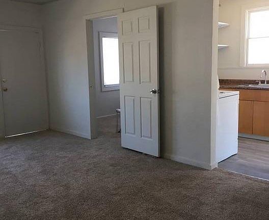 Living room facing bedroom #2 and kitchen