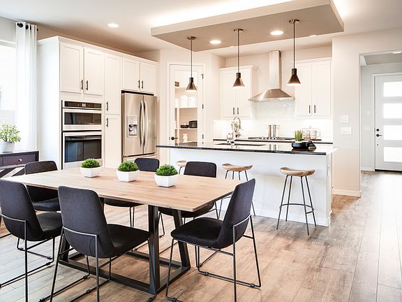 Access from the kitchen and gathering room is the cafe for formal or casual dining parties