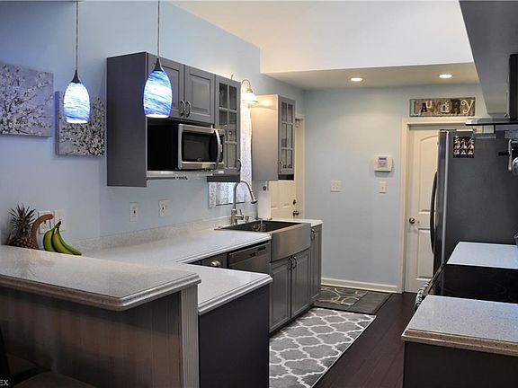 Beautiful Kitchen with Vaulted Ceiling, Quartz Counters, Included Stainless Steel Appliances, Farmhouse Style Sink, Hardwood Floors, and more.....