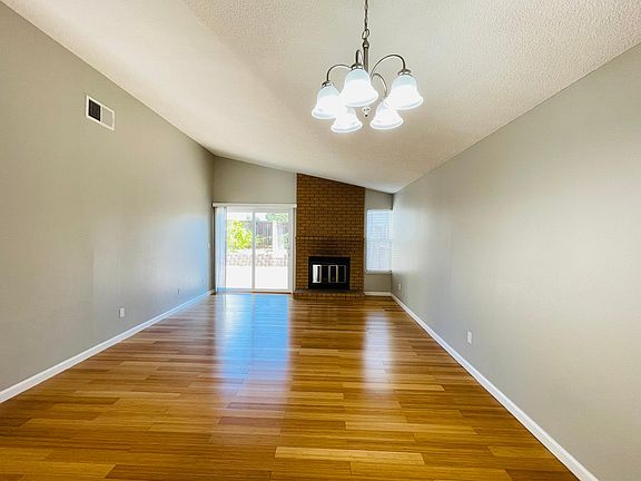High ceilings, custom paint Family room with double doors to the rear yard. Fireplace too