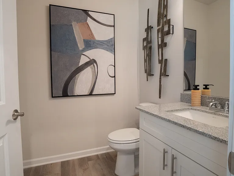 Secondary bathroom with single vanity and tub shower