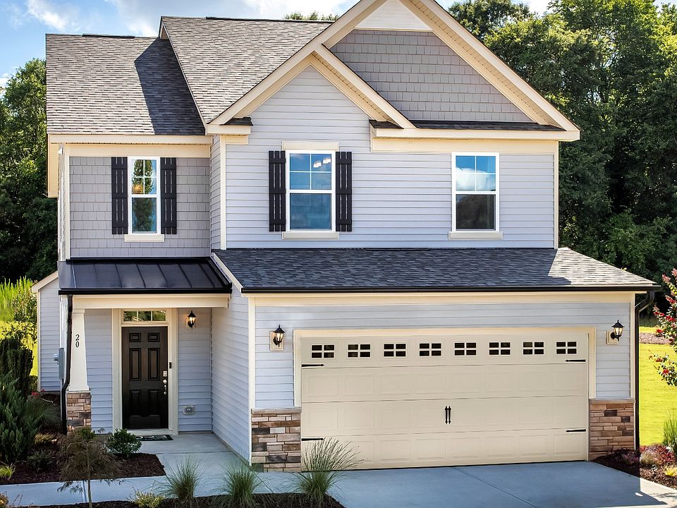 Single Family home with 2 car garage, covered front entry in the DRB Homes community of Whitley Corn