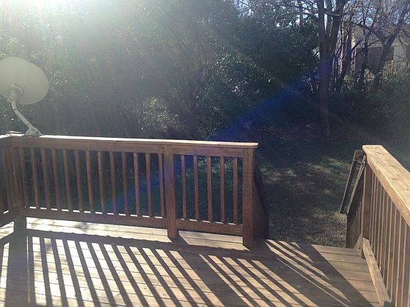 Backyard with attached storage shed and trees for privacy