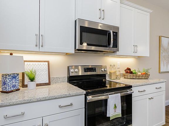 Stainless Steel Appliances, smooth-cook top range and microwave.