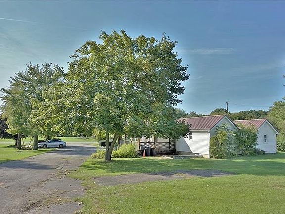 An abundance of parking on the paved driveway!