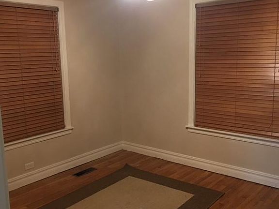 Master Bedroom with ceiling fan and wood blinds