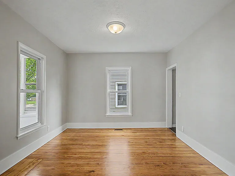 Second room on first floor that connects to basement and living room