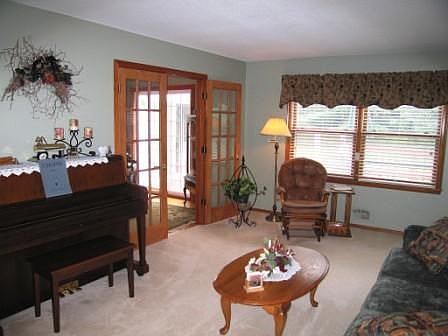 Formal living room with French doors to the dining room