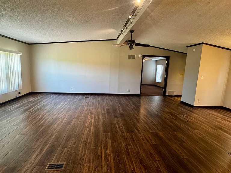 Grate room from between bar and fireplace facing Master Bedroom suite