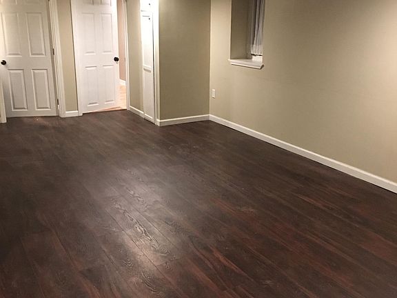 Open living area off kitchen storage cabinet