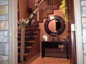 Rod Iron Spindles and Travertine Stone Entryway