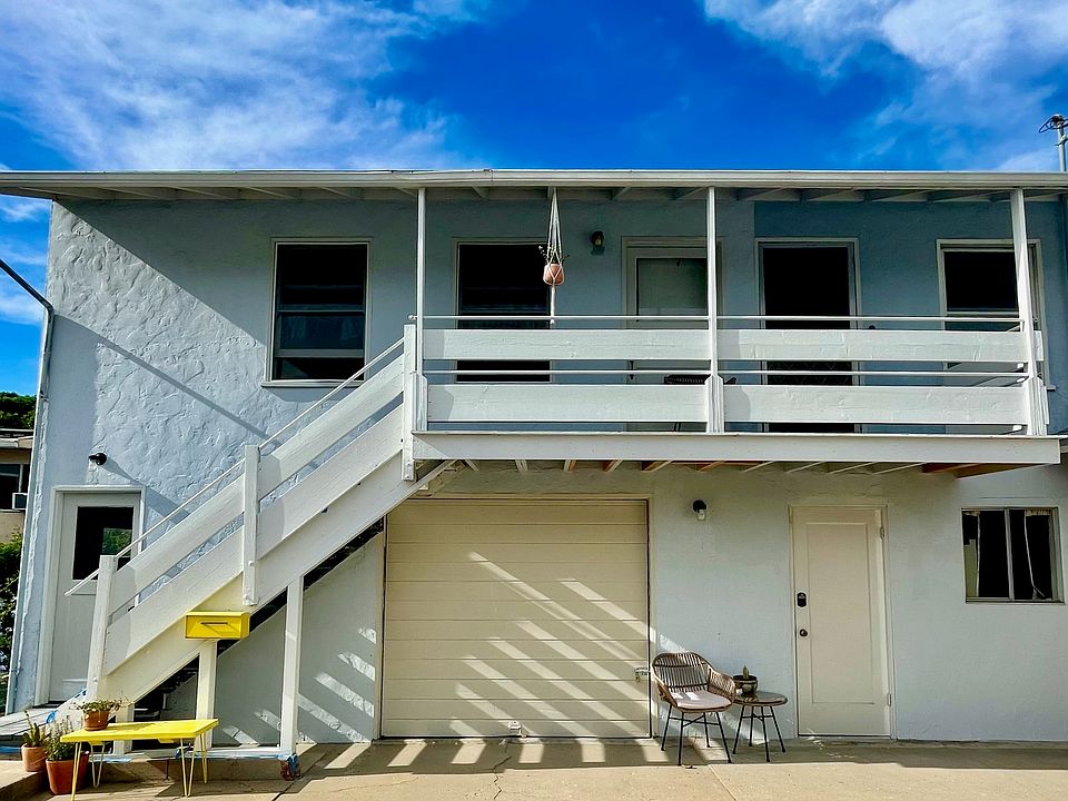 Front door is upstairs. Bottom floor garage for extra storage and access to washer/dryer