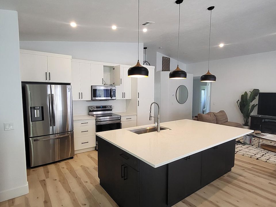 The newly renovated kitchen in this property features stunning quartz countertops and brand new stainless steel appliances. The quartz countertops are sleek and modern, providing a durable and easy to clean surface for food preparation. The brand new stai
