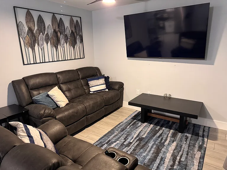 3667 Unlimited access to fully furnished common area living room, ceiling fan, 70" TV with complimentary streaming channels.